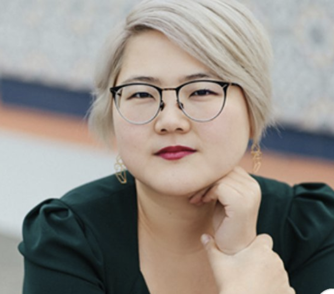 Photo of ace author Angela Chen wearing glasses and lipstick