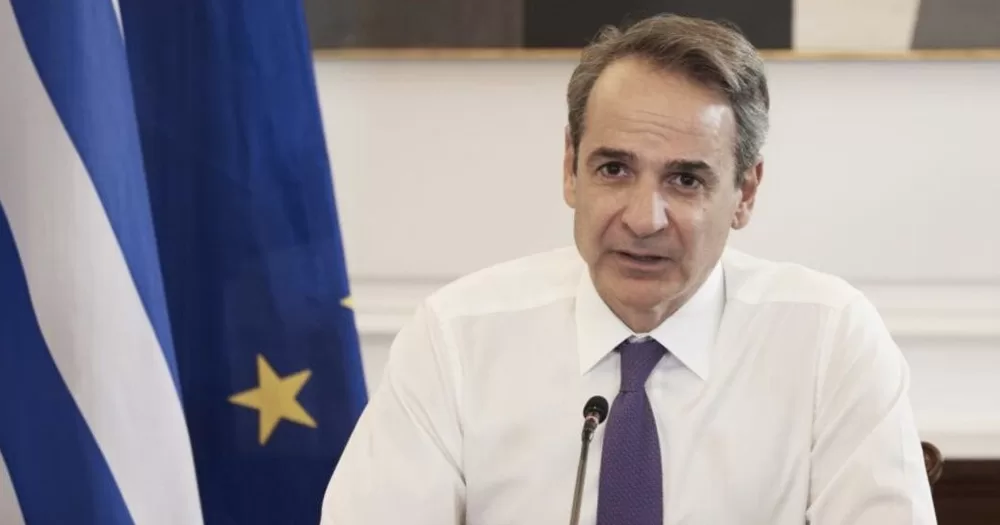Greek PM Kyriakos Mitsotakis, who pledged to legalise same-sex marriage, speaking in a microphone.