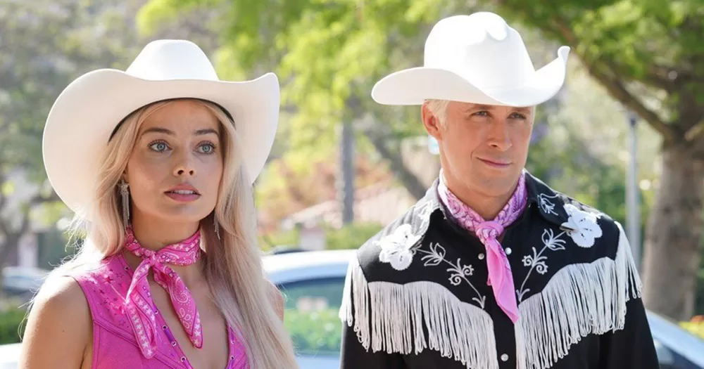 A still from the Barbie movie, which is being added to the Leaving Cert curriculum. The photo shows Barbie (Margot Robbie) and Ken (Ryan Gosling) from the chest up, dressed in cowboy hats, pink neckerchiefs and cowboy shirts.