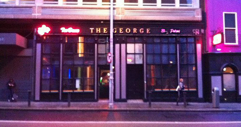 The image shows the from of the George nightclub where a former bouncer has brought an unfair dismissal case. The image shows a double fronted building with multiple windows. It has neon lights over the top of the building.