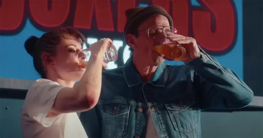 Kristen Stewart and Seth Meyers chugging pints of alcohol.