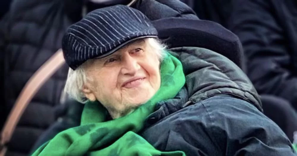 Photo of Irish actor, singer, and LGBTQ+ ally Malachy McCourt wearing a green scarf.