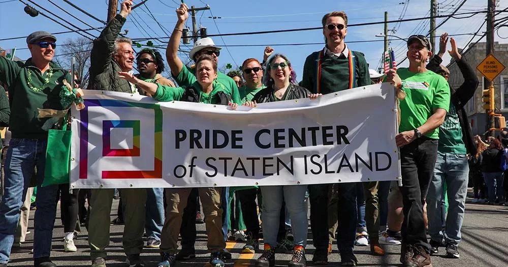 Group of people hold Pride banner in inclusive Staten Island St Patricks Day parade