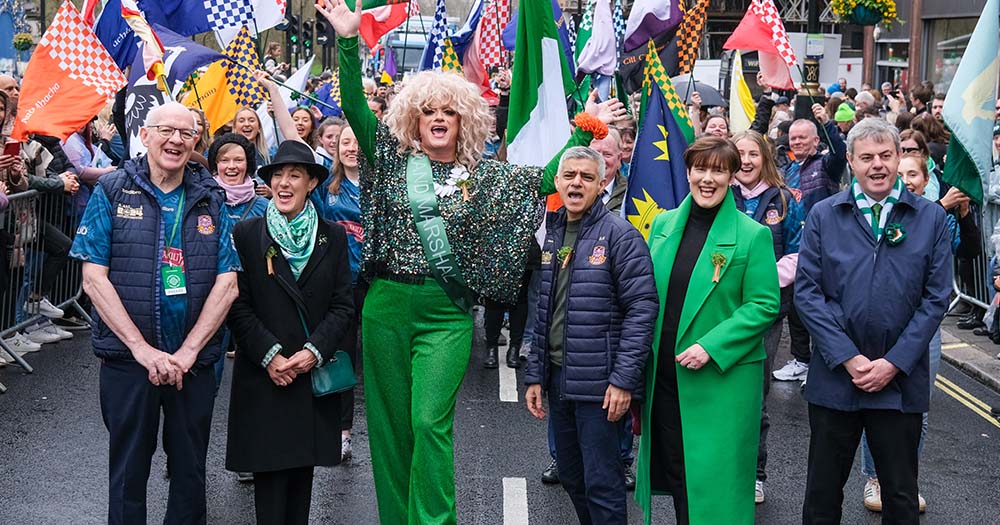Photo of Panti Bliss standing with a crowd in the London St Patricks Day parade