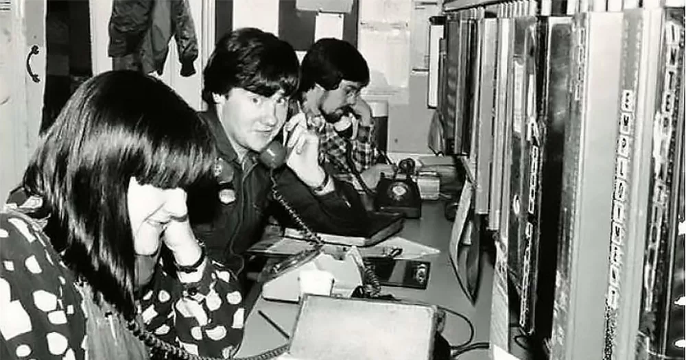 The picture shows volunteers of the UK Switchboard LGBTQIA+ Support Line taking their first calls.