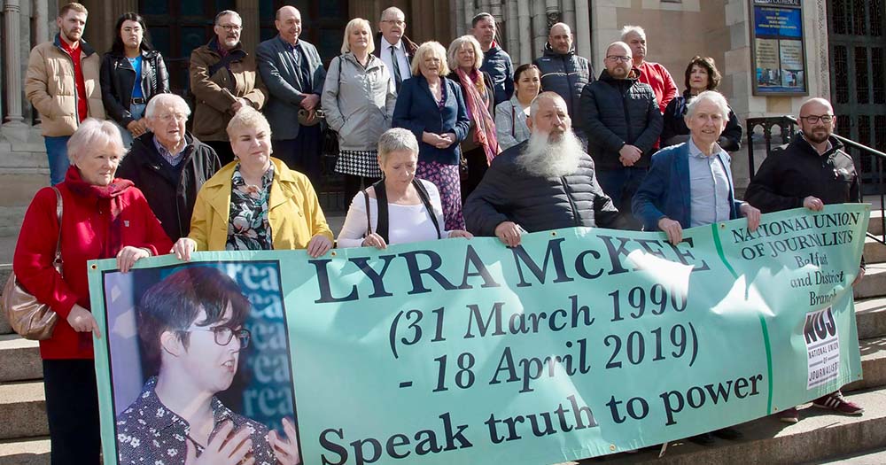 Journalists holding a banner honouring Lyra McKee prior to her murder trial.