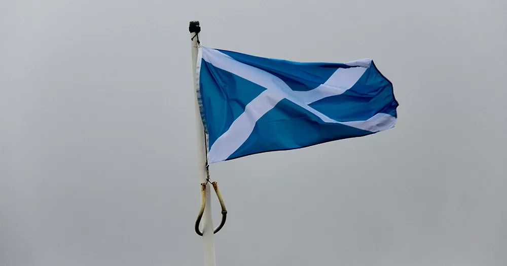 This article is about Scotland's new hate crime law. The image shows a Scottish flag flying on a flag pole.