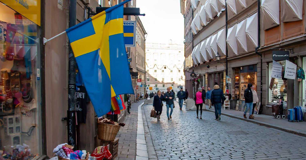 Swedish flag flying on the streets of Stockholm.