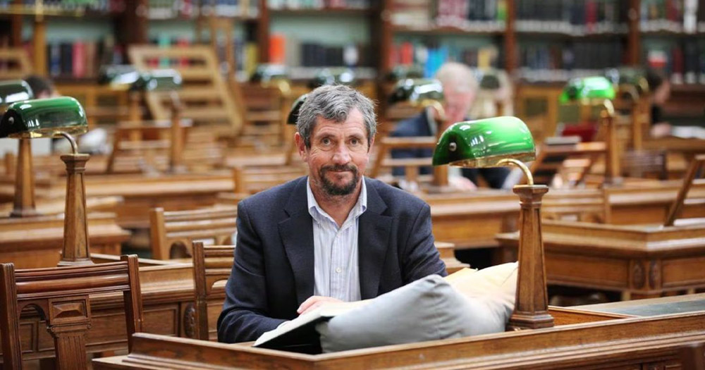 A photo of late Irish journalist and focus of new documentary Ransom '97 Charlie Bird sitting in the Reading Room at the National Library of Ireland.