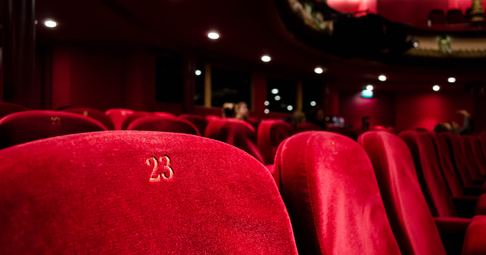 This article is about two shows at the International Dublin Gay Theatre Festival. In the photo, red seats in a theatre.