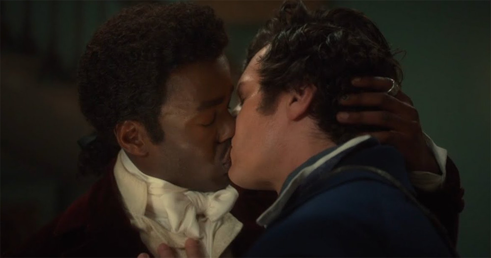 A screenshot from Doctor Who where the Doctor is sharing a kiss with Rogue.