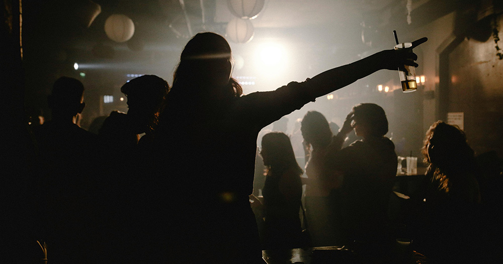 This article is about a new club night, Tough Love, launching in Dublin. The image shows the silhouette of a woman on a dancefloor, with a crowd of people in the background.