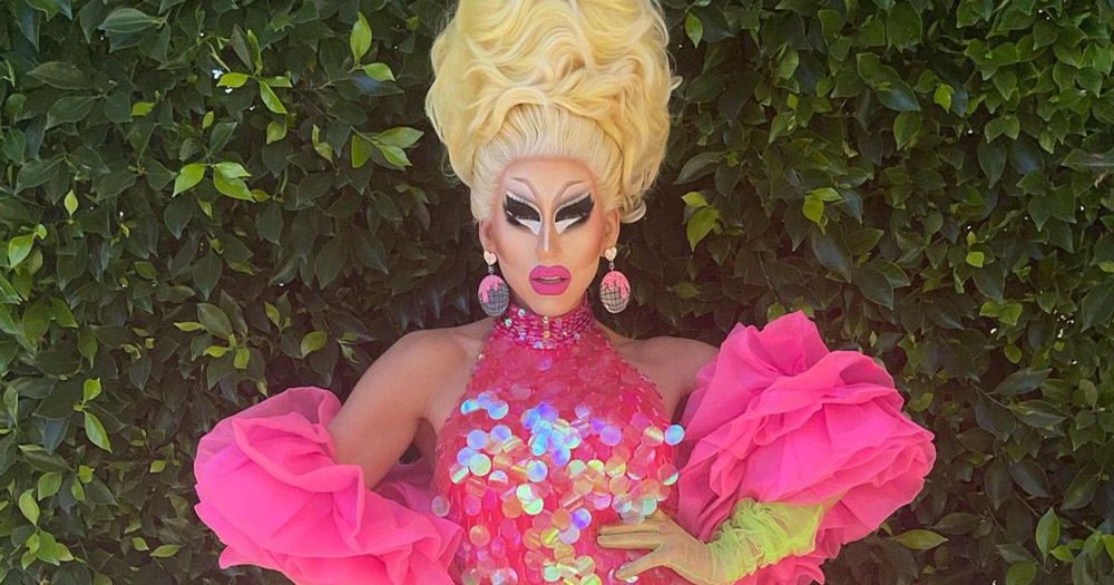 A photograph of RuPaul's Drag Race All Stars 3 winner Trixie Mattel in a blond wig and pink gown.