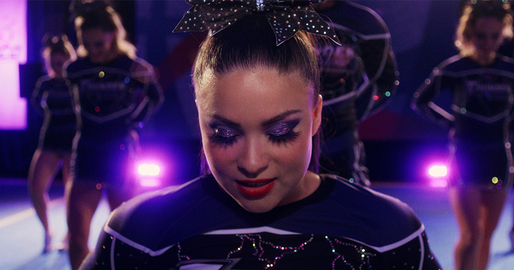 Devery Jacobs stars as Cheerleader Riley in new queer cheer drama film 'Backspot'.