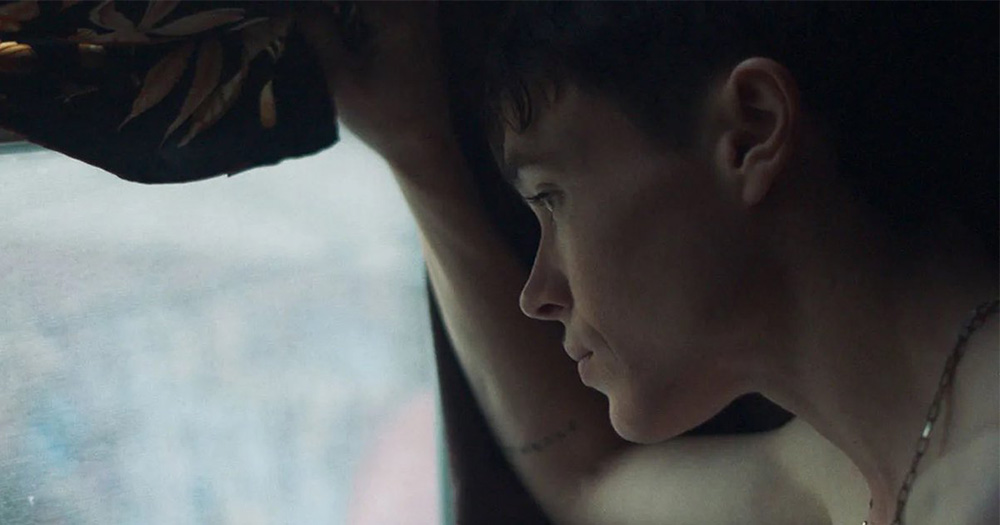Elliot Page (Sam), star of new film 'Close to You', shown in scene looking out a window.