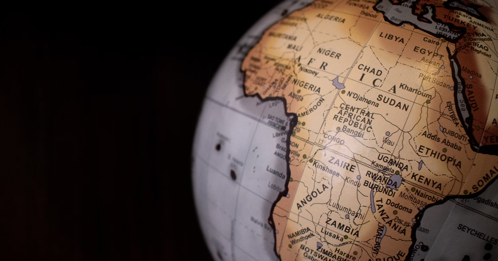 This article is about homophobia in societies in Africa. In the photo, a globe showing the map of Africa on a dark background.