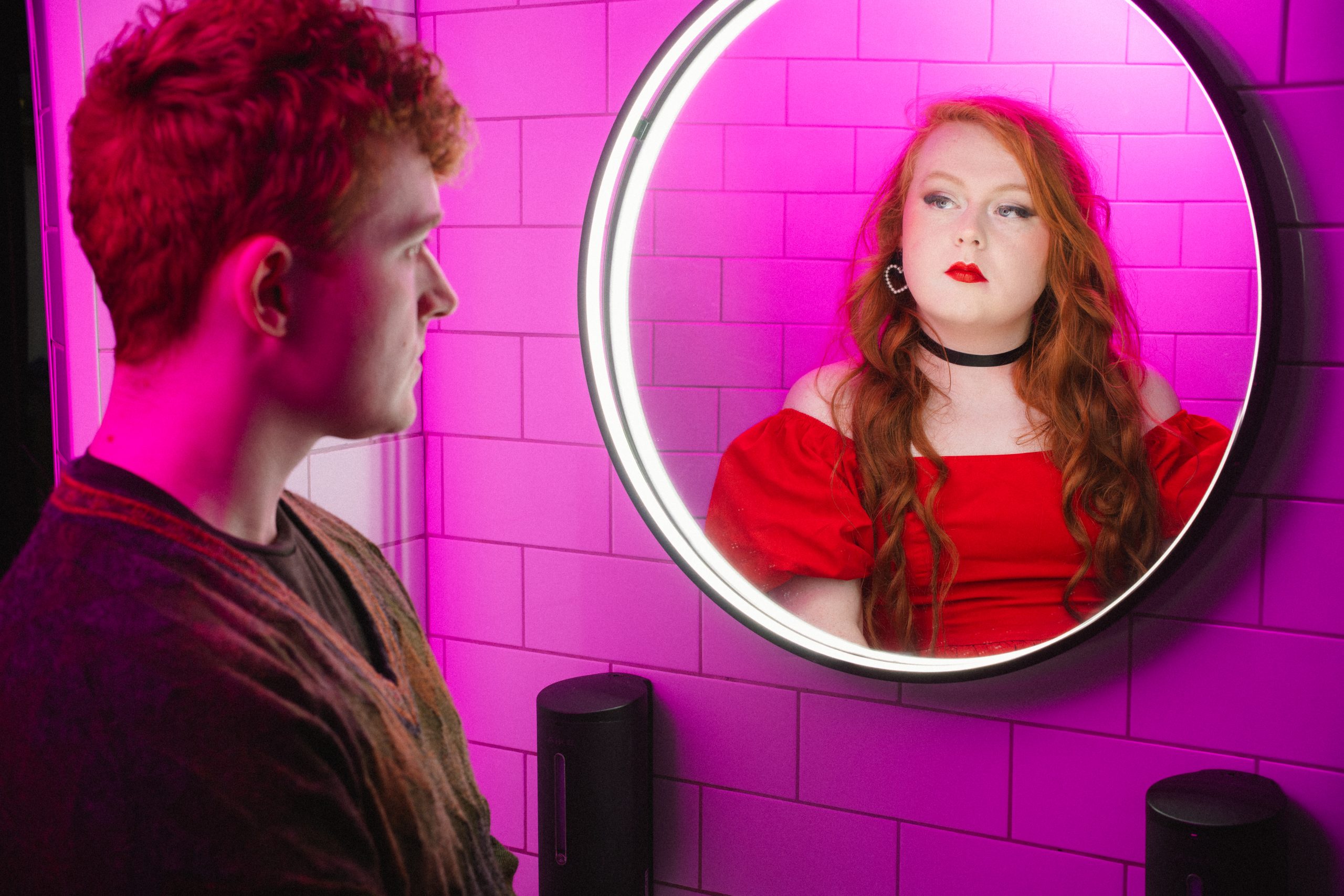 Image shows the character looking into the mirror and seeing Rose reflected back.