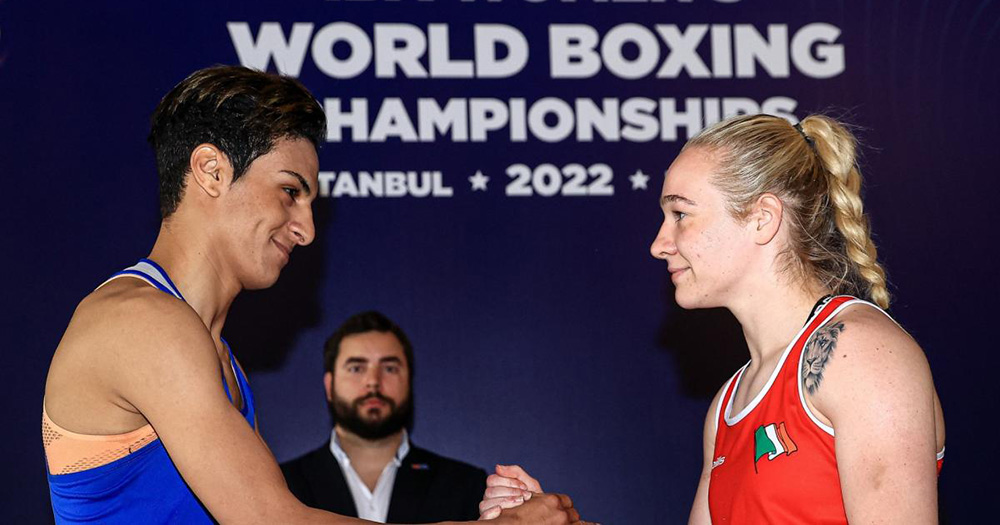 Imane Khelif (left) shaking hands with Amy Broadhurst (right) and the World Boxing Championships.