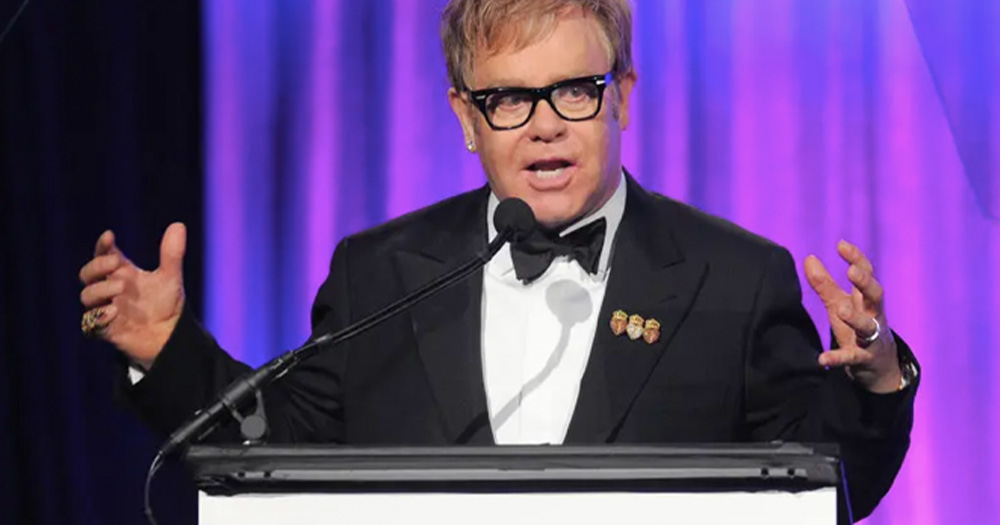 elton john speaking on a panel for the Elton John AIDS foundation