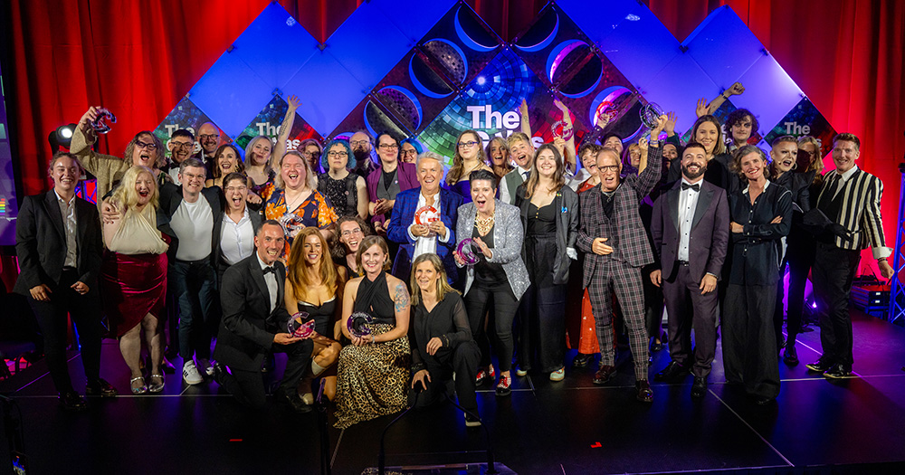 A group image of all the GALAS 2024 awardees on stage smiling and cheering.