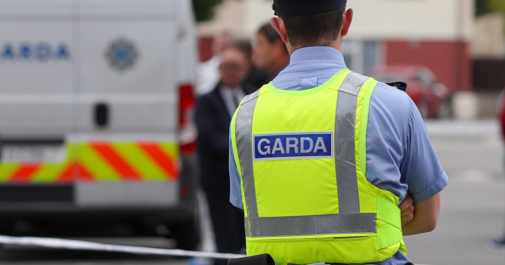 This article is about a Dublin man pleading guilty to targeting men through Grindr and robbing them. In the photo, a Garda with his back facing the camera in uniform.