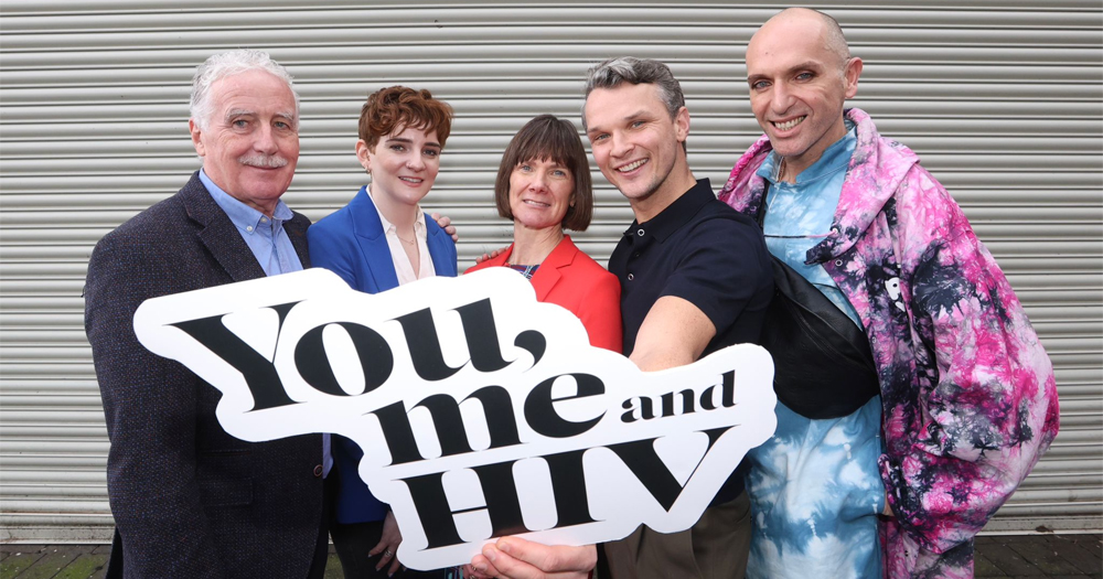 This article is about a new campaign to tackle HIV stigma in Ireland. In the photo, HIV activists holding a sign that reads You Me and HIV.