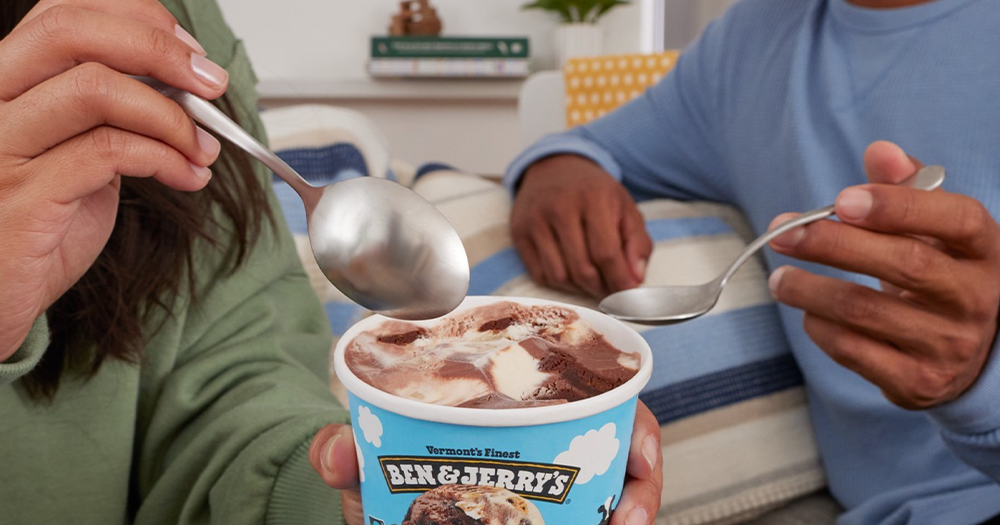 Image shows two people enjoying Ben & Jerry's ice cream, whose parent company recently removed their CEO due to the companies social justice activism