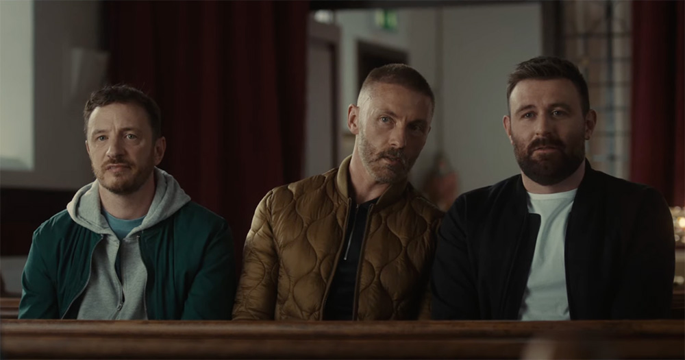 A screenshot from the Four Mothers trailer showing three men, played by Gearóid Farrelly, Gordon Hickey and James McArdle, sitting side by side.