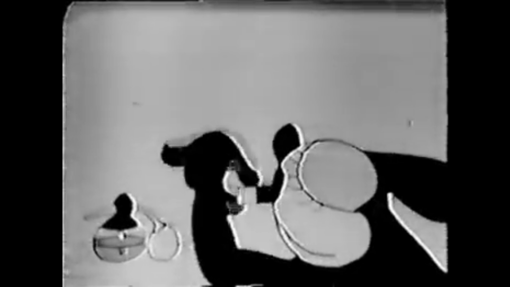 Oswald the Lucky Rabbit is a black and white rabbit who is putting on lipstick.