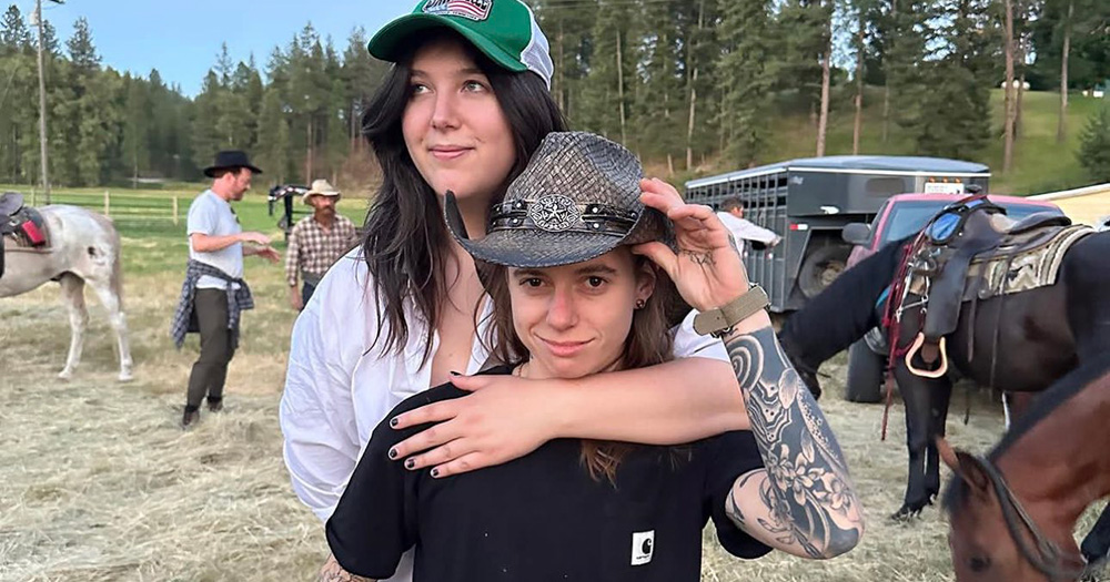 A photo of Lucy Dacus with her arm around Julien Baker.