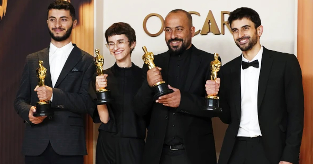 Photo of four Palestinian directors Basel Adra, Hamdan Ballal, Yuval Abraham and Rachel Szor after they won the Oscar.