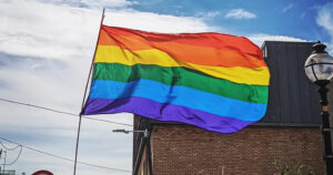 This article is about Ireland's ranking in the Rainbow Europe Map. In the photo, a Pride flag flying in the streets of Dublin.