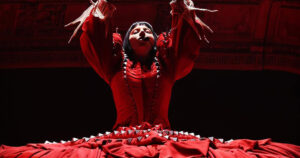 Lady Gaga in a red outfit at her record-breaking concert in Brazil.