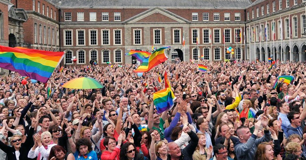 Image shows crowds celebrating Marriage Equality in Ireland in 2015