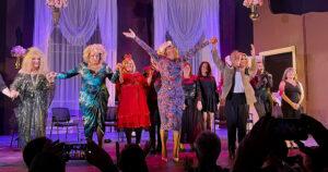 Notable figures on stage at the Roast of Panti Bliss cheering in front of the audience. Cast includes Panti Bliss, Brendan Courtney, Davina Devine, Dizzy Dyin4it and Mr Pussy, Tara Flynn, Katherine Lynch, Bláthnaid Ní Chofaigh,James Patrice, Paul Ryder and Elaine Crowley.