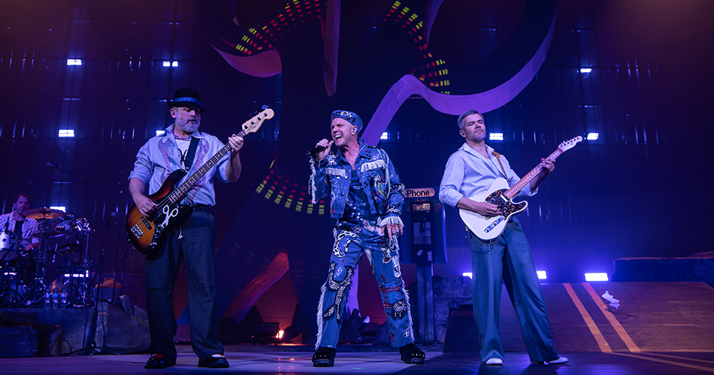 Photo of Scissor Sisters performing live on stage.