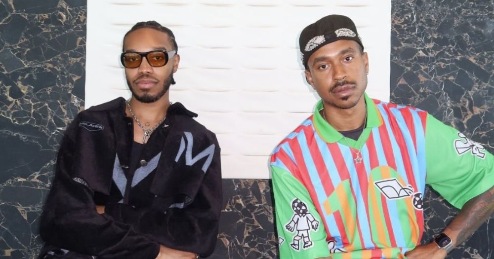 Two Black men, Ziggy and Michael, sitting together facing the camera for the BLK campaign
