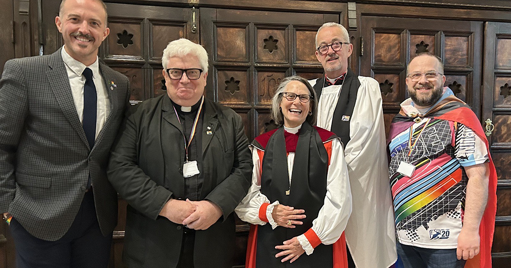 Five people smiling for a photo at a Pride sermon in Dublin's Christ Church Cathedral.