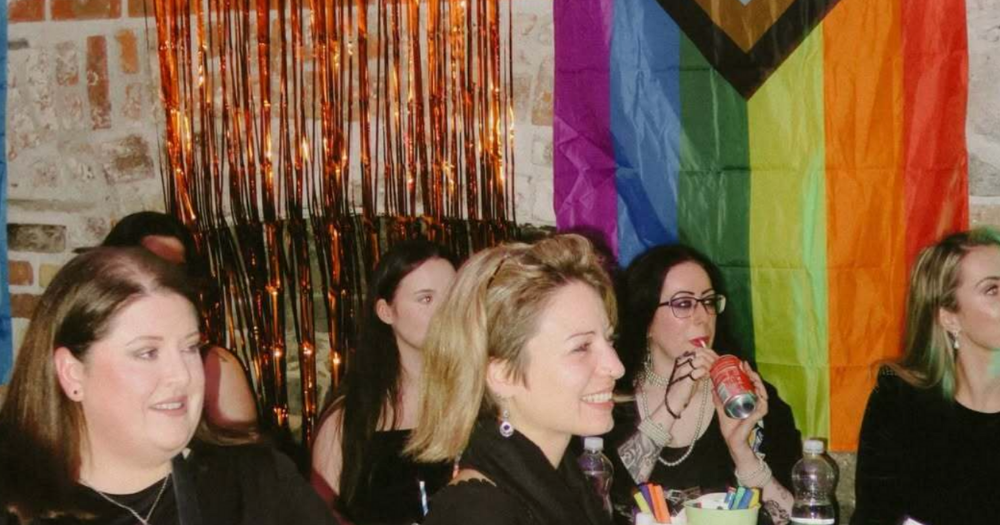 Photo shows people at a Pride event celebrating sobriety