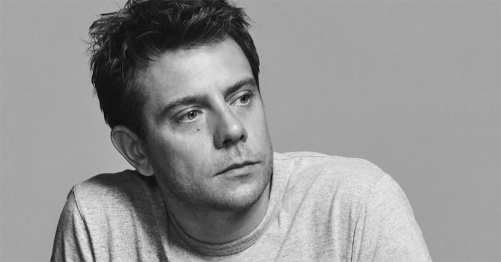 A black and white image of Jonathan Anderson.