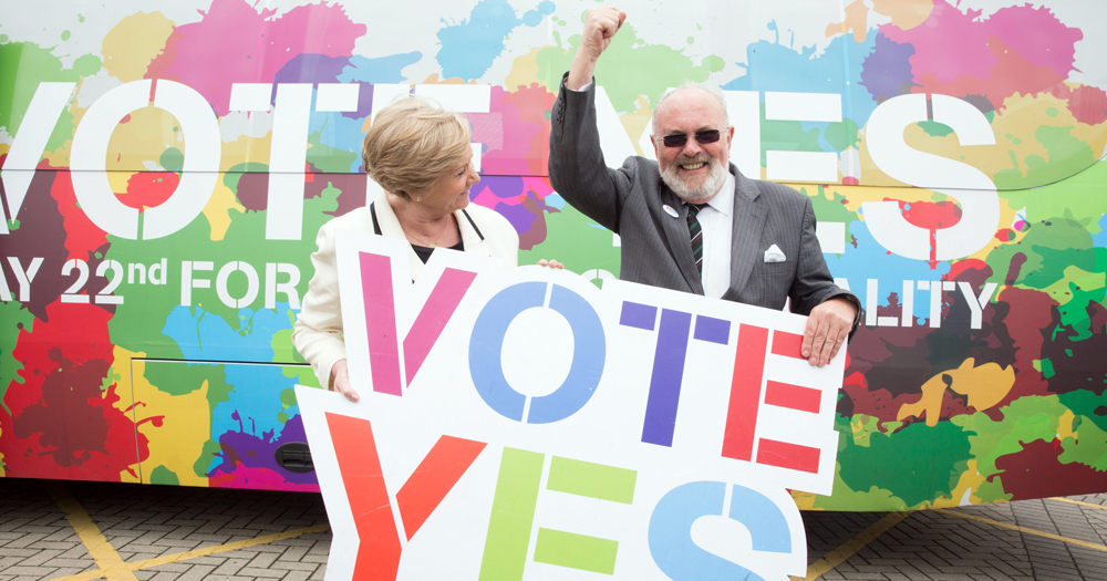 Photo by the National Library of Ireland with David Norris and another activist holding a sign that reads "Vote Yes".