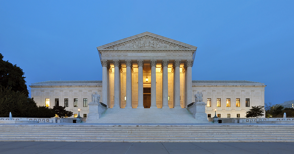 Panorama of the US Supreme Court building at dusk.