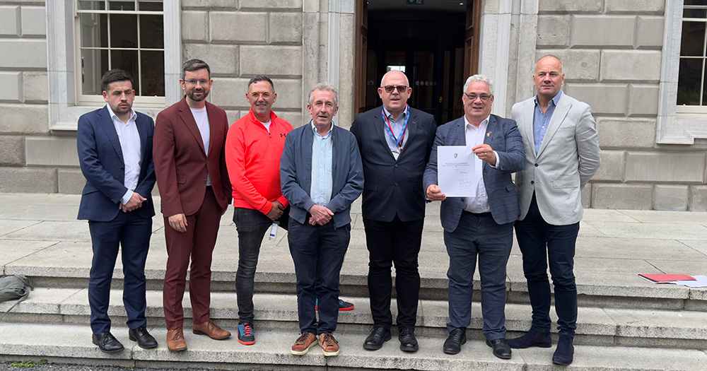 Campaigners and politicians outside the Dáil with a new bill to disregard historic convictions for consensual gay sex.