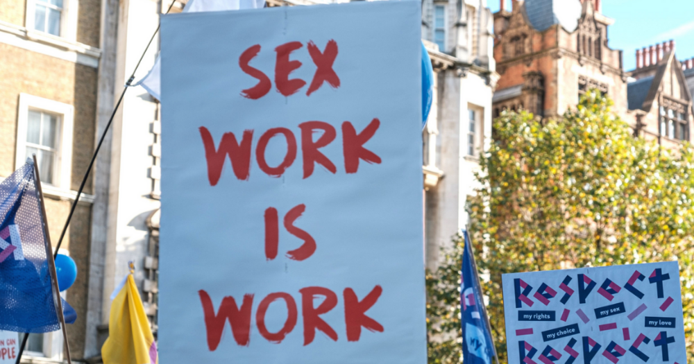 Image shows a poster reading Sex Work Is Work. The Sex Workers Alliance Ireland has announced its closure