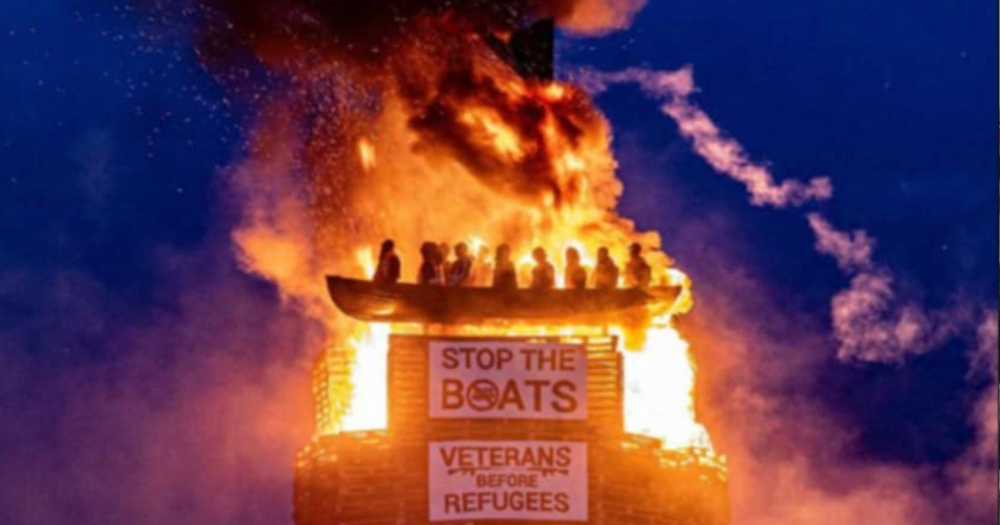 Image shows the burning of migrant boat efegy at a bonfire in Tyrone