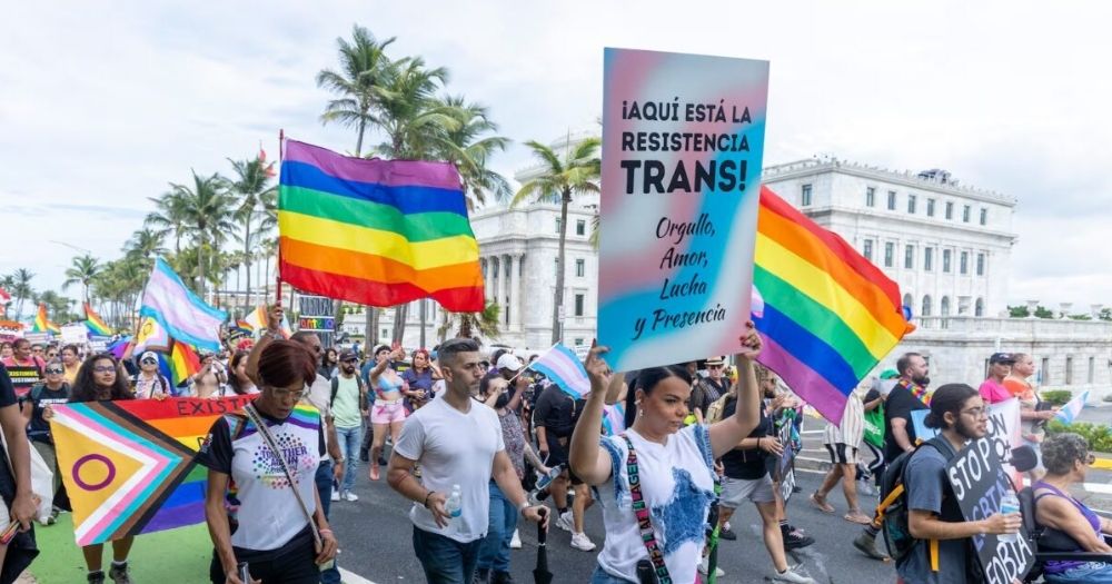 Image shows people marching for LGBTQ+ rights in Puerto Rico.
