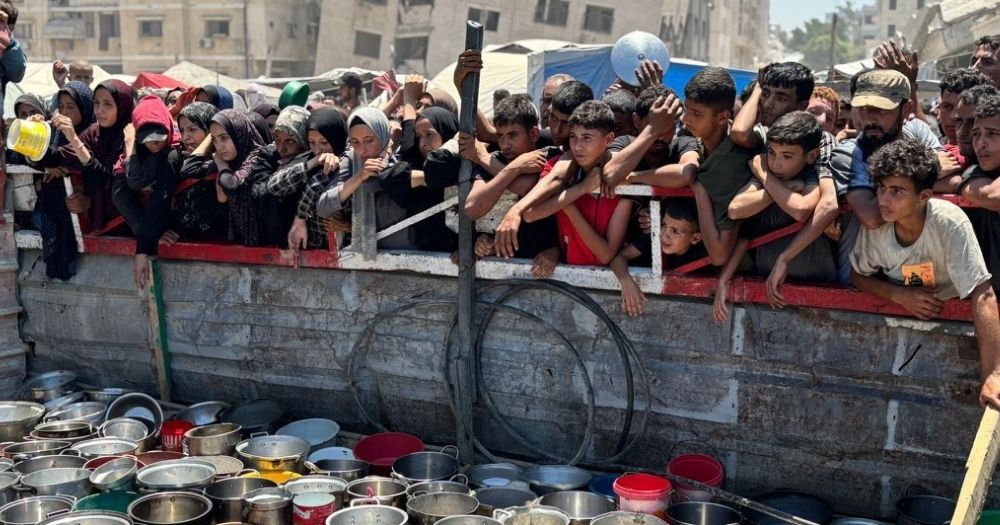 People in Gaza trying to access food as they face a man-made mass starvation.