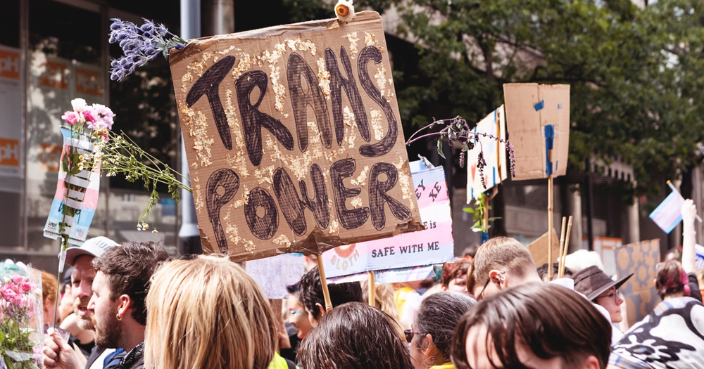 This article is about the impact of Gender Recognition on members of the trans community, In the photo, people marching with one of them holding a sign that reads "Trans Power".