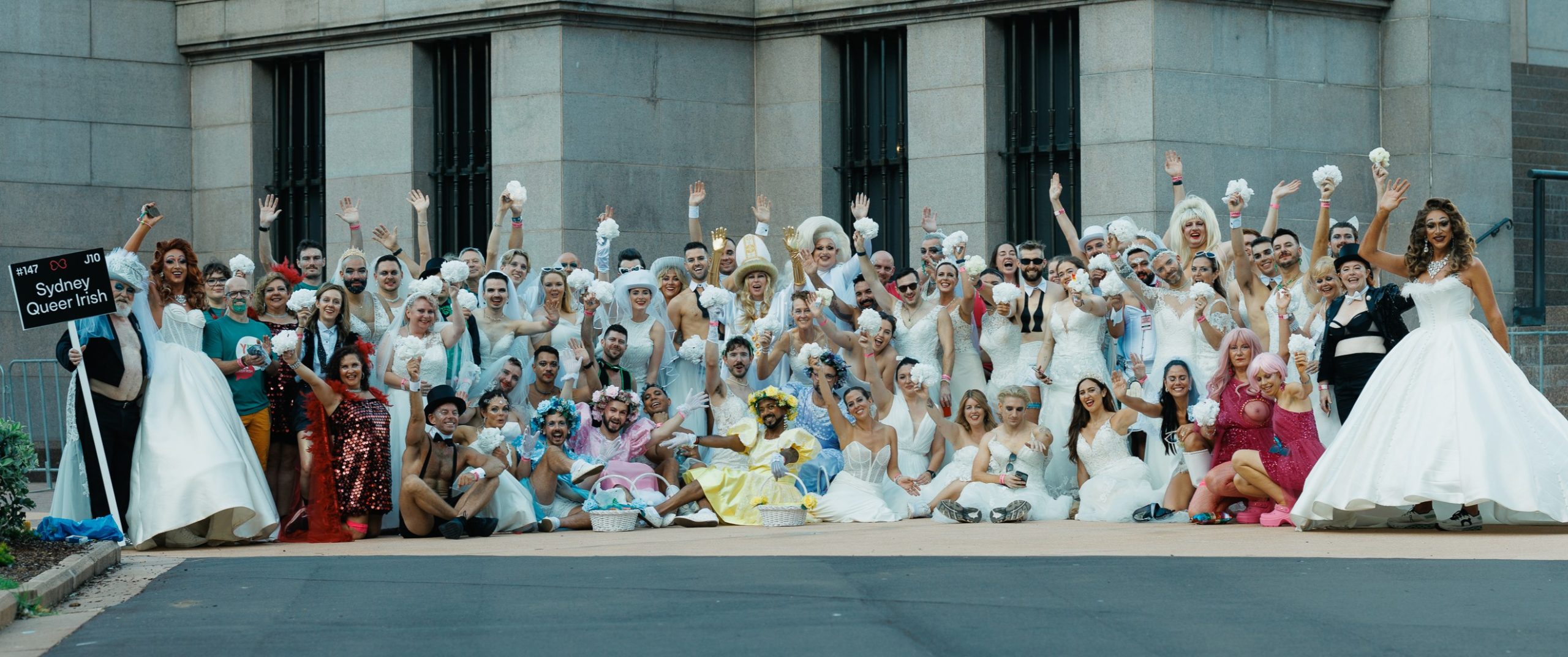 People taking part in a wedding parade in Sydney in celebration of Marriage Equality.