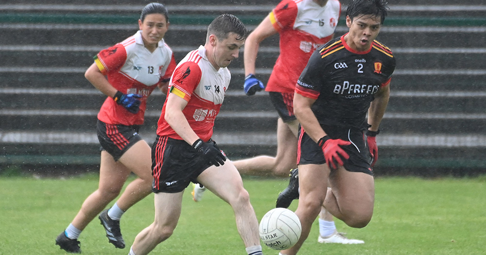 Action shot of LGBTQ+ clubs Aeracha Uladh and Na Laochra Aeracha playing a GAA match.